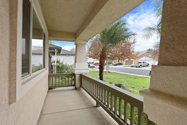 a view of a porch with a yard