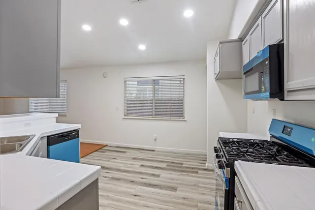 a kitchen with a stove and a microwave