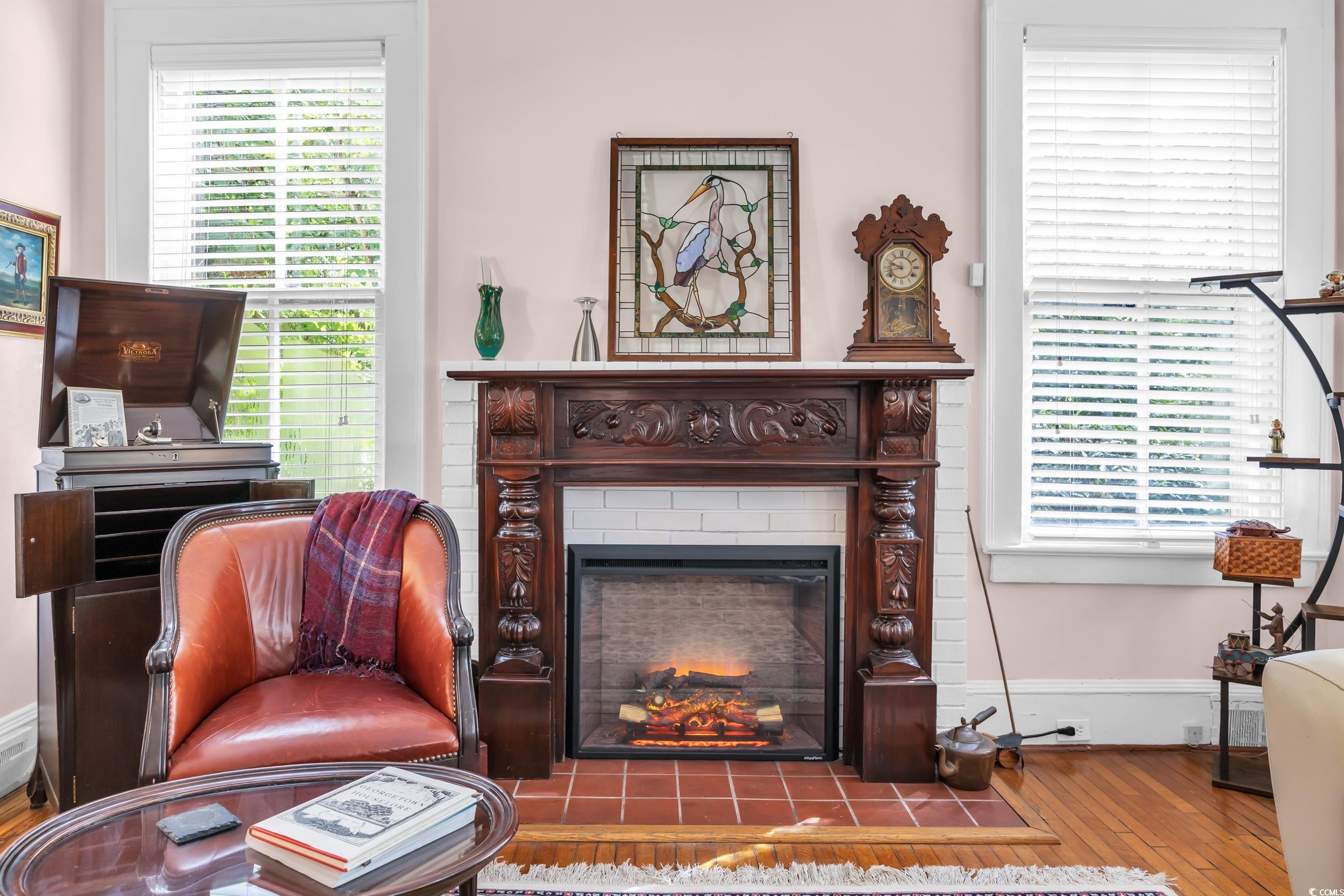 209 Cannon Street Georgetown, SC 29440 - Photo 10 of 34 Sitting room with hardwood / wood-style flooring and a fireplace with flush hearth