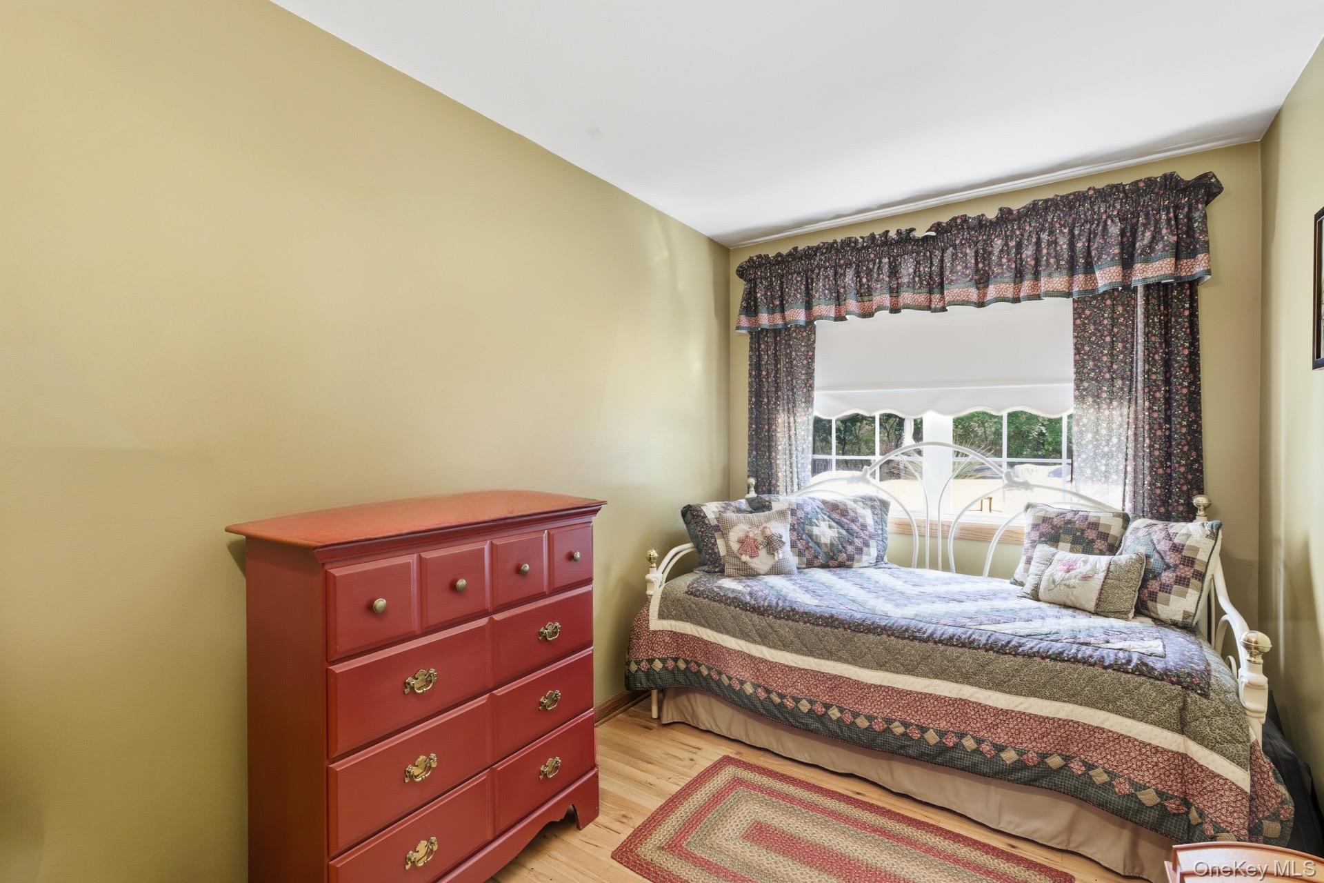 347 Wading River Road Manorville, NY 11949 - Photo 11 of 30 Bedroom featuring light wood finished floors
