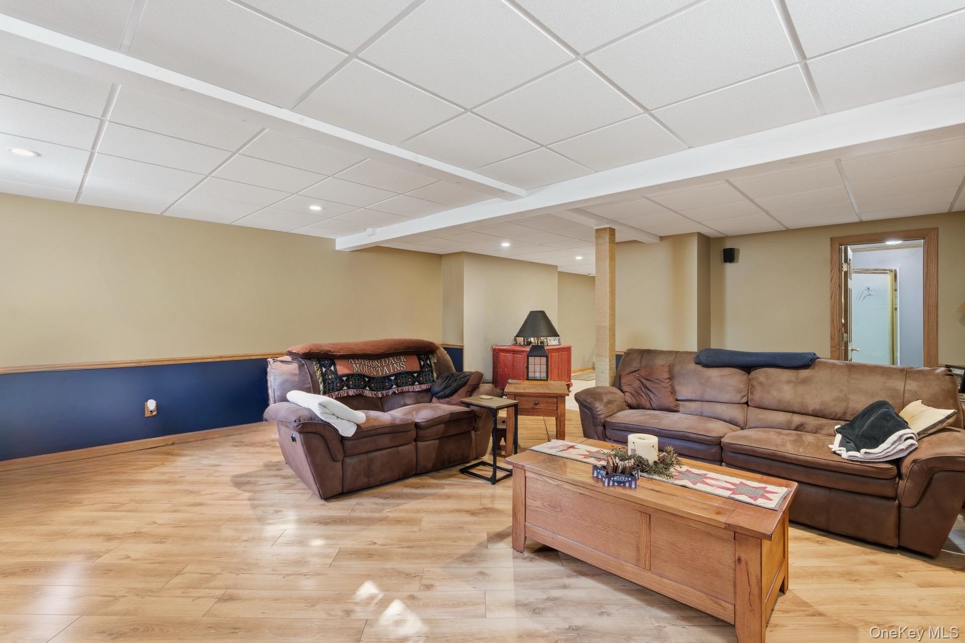 347 Wading River Road Manorville, NY 11949 - Photo 17 of 30 Living area with a paneled ceiling, light wood finished floors, and recessed lighting
