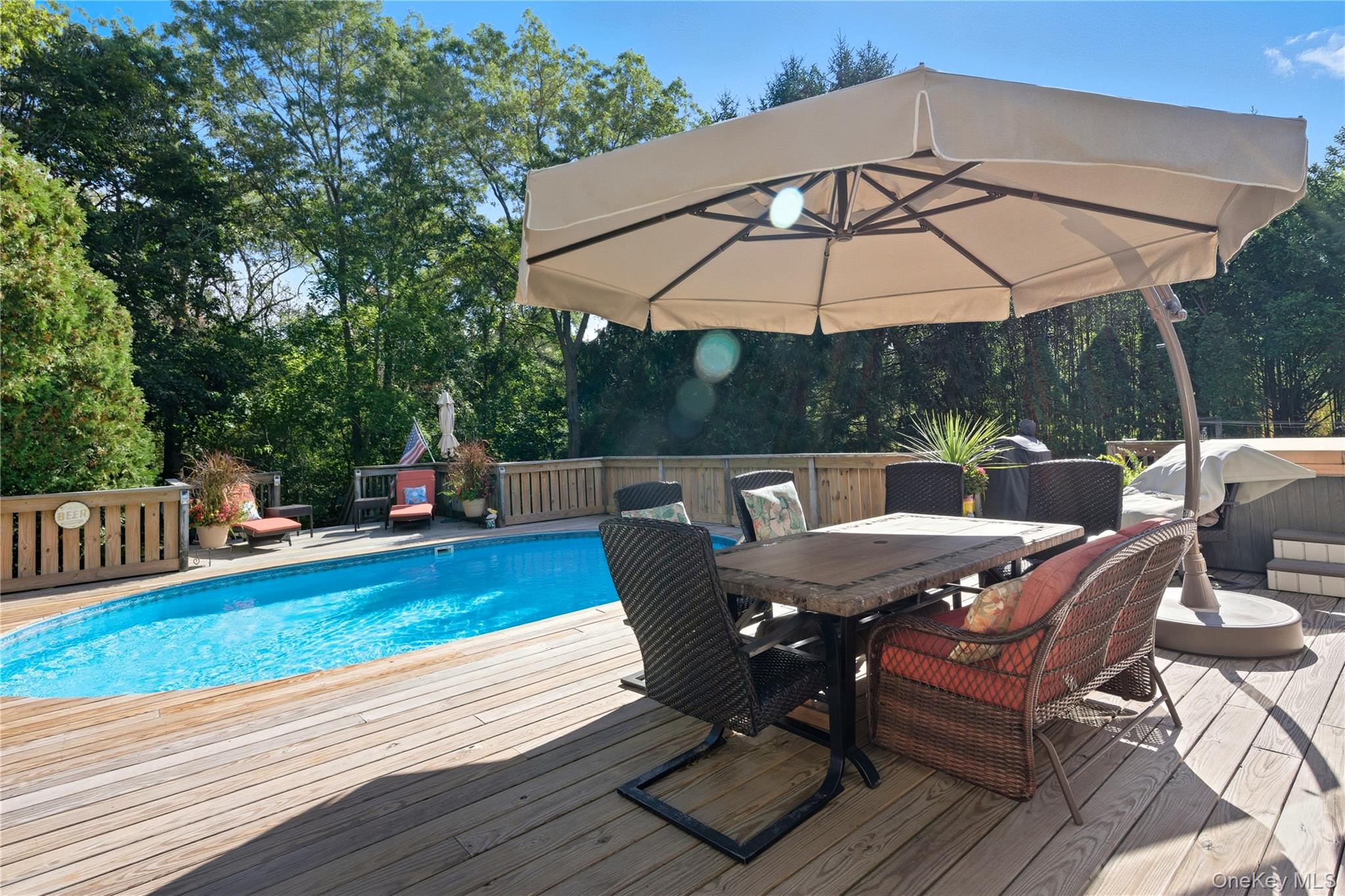 347 Wading River Road Manorville, NY 11949 - Photo 26 of 30 Outdoor pool featuring outdoor dining space and a deck