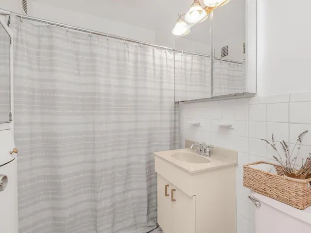 a bathroom with a sink a vanity and a mirror