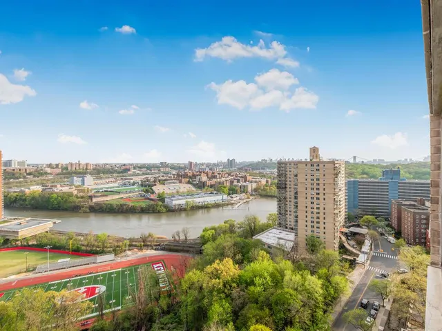 a view of a city with lawn chairs
