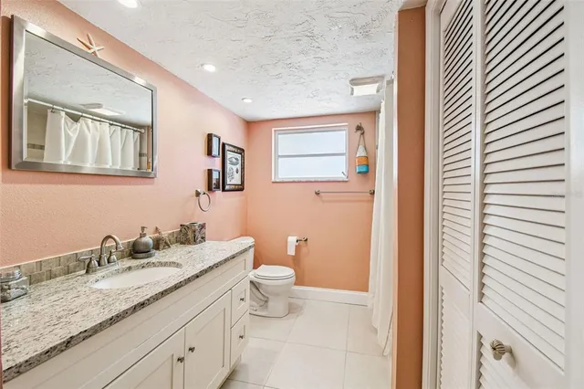 a view of a livingroom with a fireplace and window
