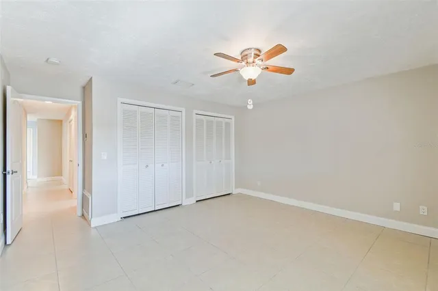 a view of an empty room with a fireplace