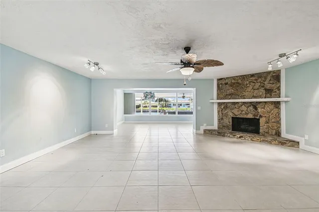 a view of a kitchen with a sink and refrigerator