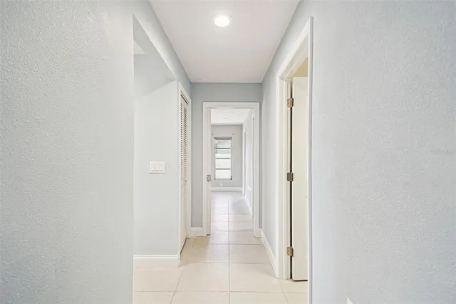 a view of swimming pool with outdoor seating and lake view