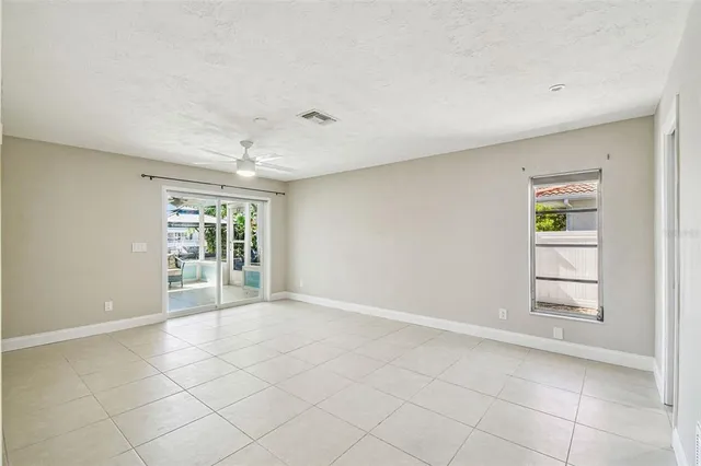 a view of a dining table and chairs in the patio