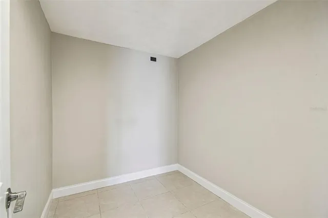 a building outdoor space with patio furniture and potted plants