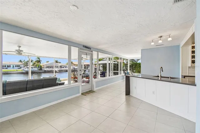 an aerial view of residential houses with outdoor space and parking