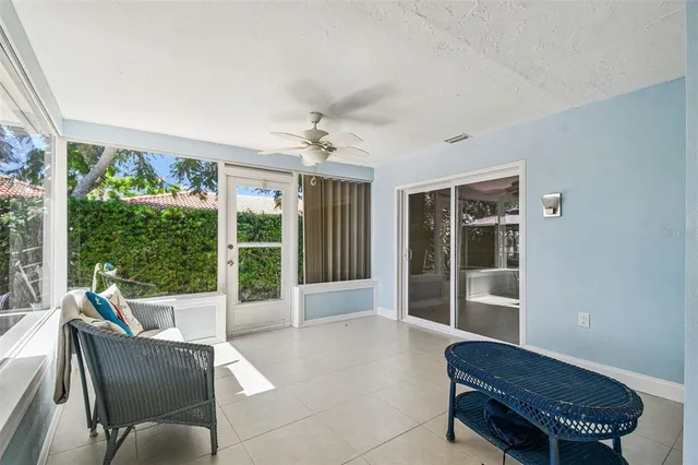 swimming pool view with a seating space and a garden view