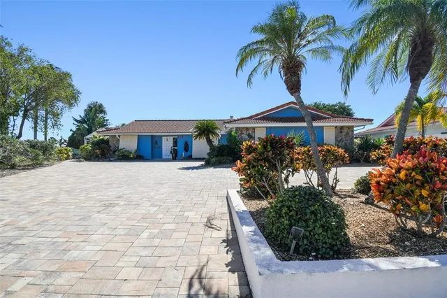 an empty room with closet and windows