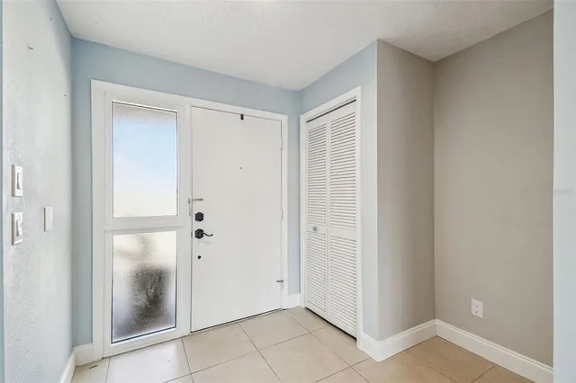 a bathroom with a granite countertop sink toilet and a mirror