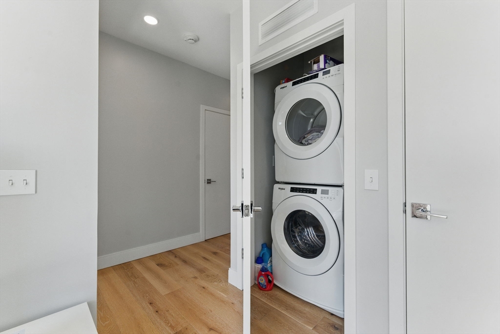 191 Washington Street, Unit 524 Boston, MA 02135 - Photo 13 of 42 a utility room with dryer and washer