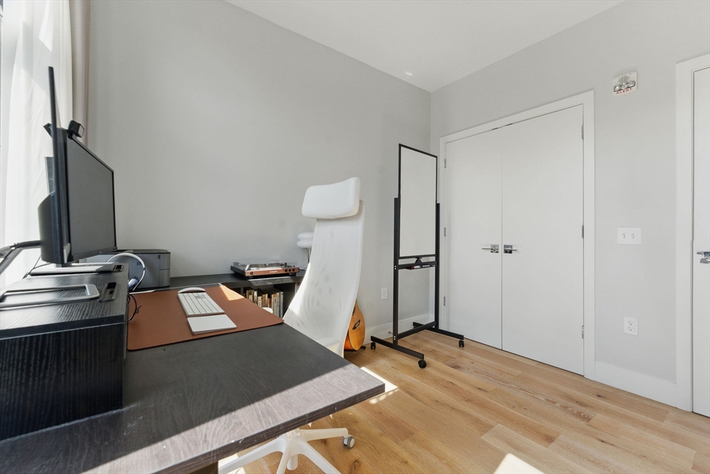 191 Washington Street, Unit 524 Boston, MA 02135 - Photo 23 of 42 a view of a room with gym equipment