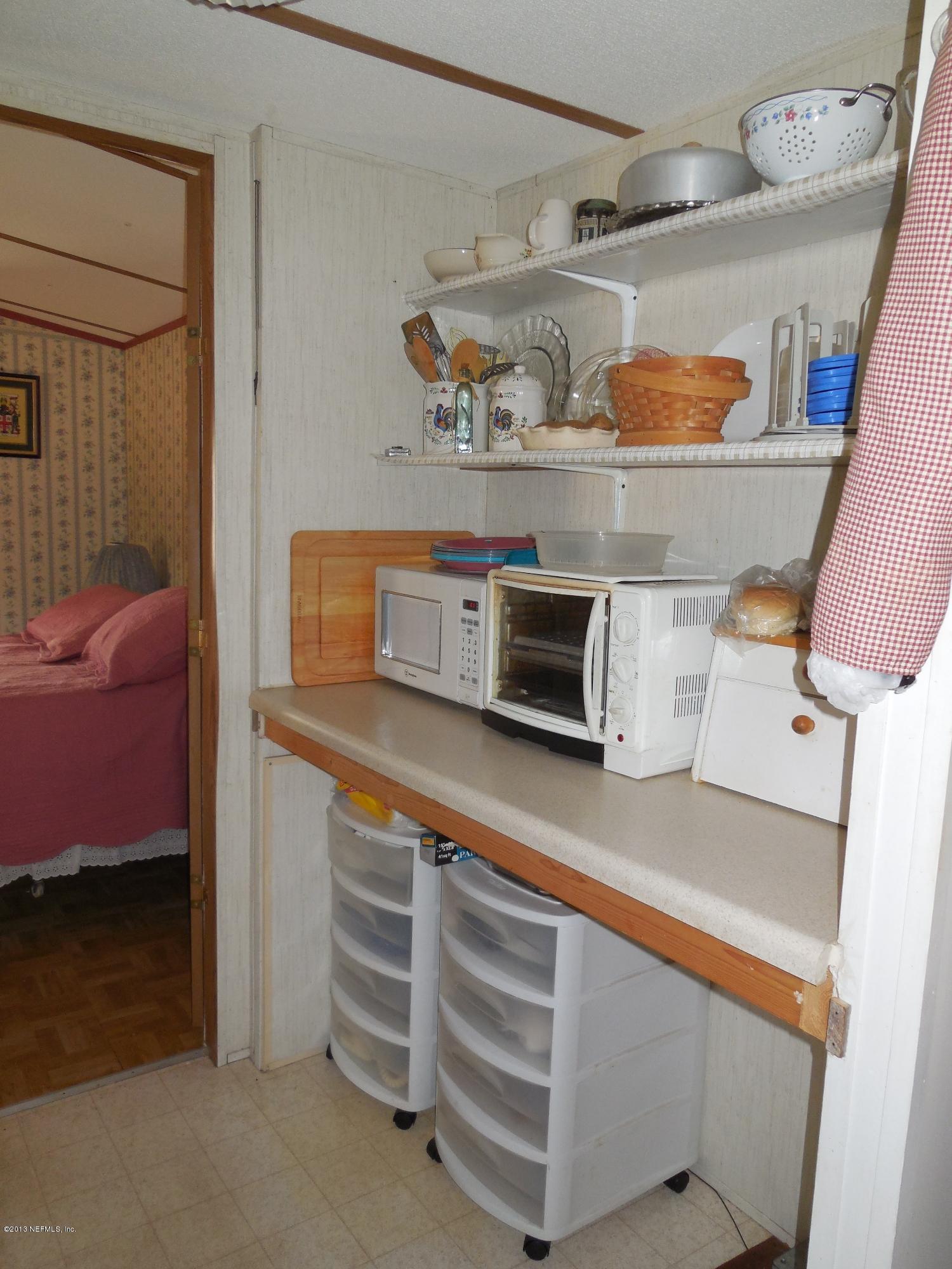 105 Ketner Road Welaka, FL 32112 - Photo 12 of 34 a room with storage and utility