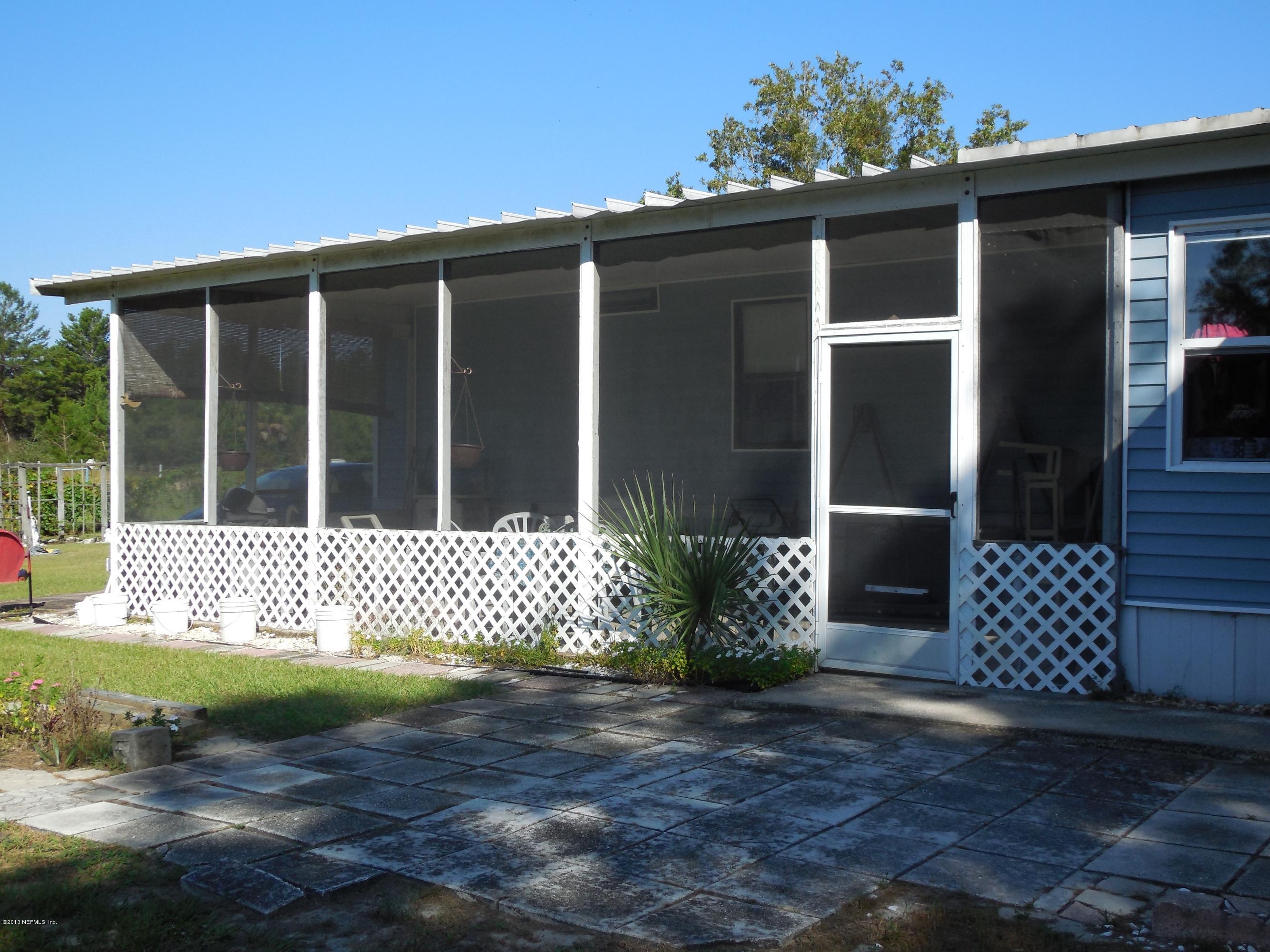 105 Ketner Road Welaka, FL 32112 - Photo 27 of 34 a view of a house with a yard