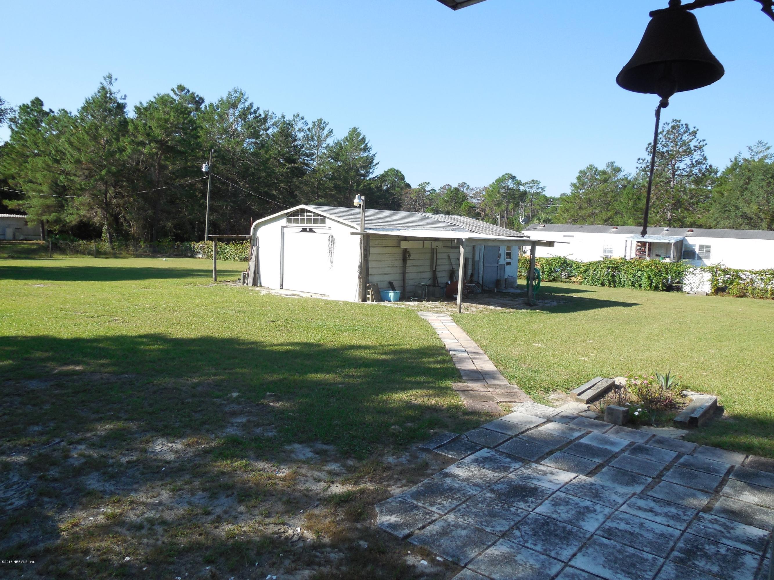 105 Ketner Road Welaka, FL 32112 - Photo 28 of 34 a view of a house with a yard and lake view