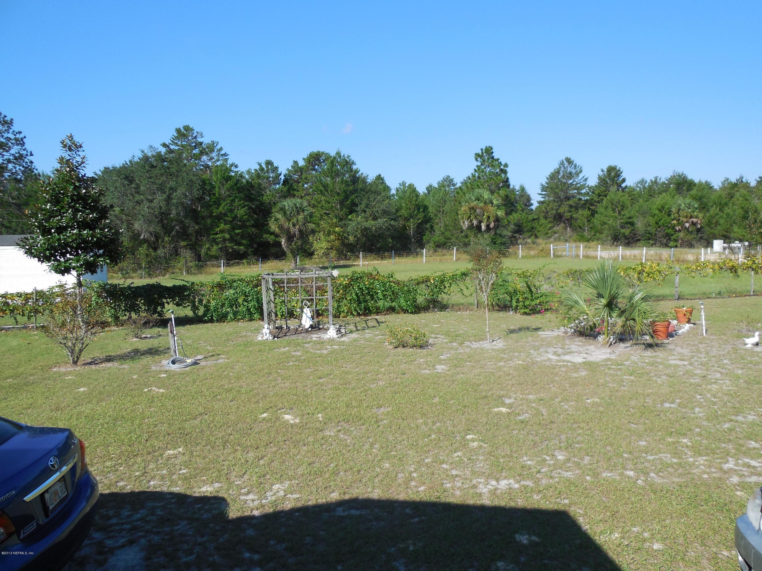 105 Ketner Road Welaka, FL 32112 - Photo 32 of 34 a view of a lake view with a big yard