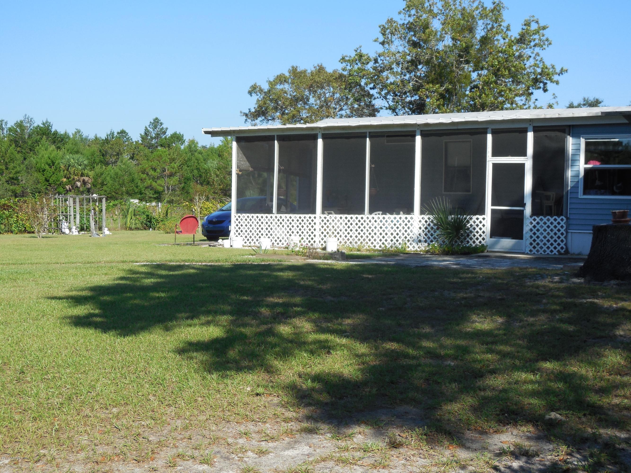 105 Ketner Road Welaka, FL 32112 - Photo 33 of 34 a front view of a house with a yard