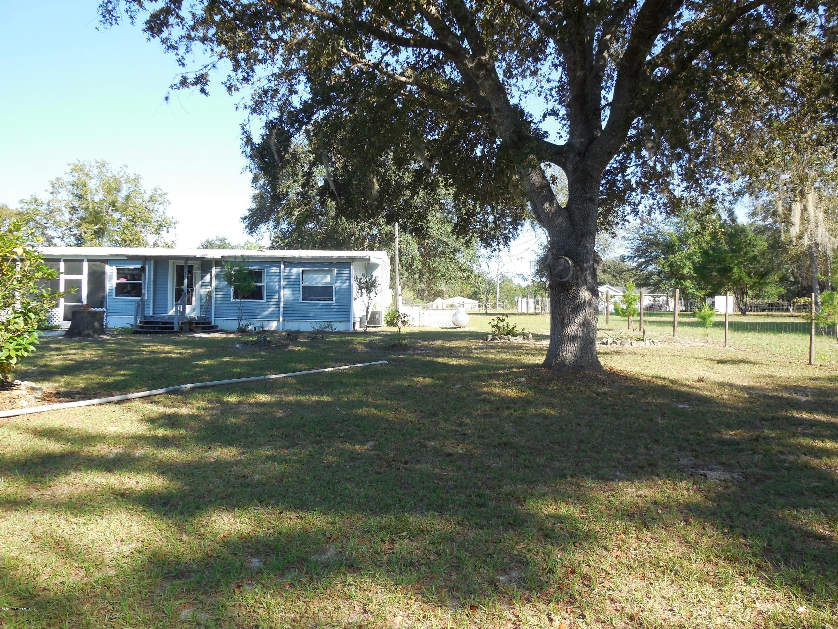 105 Ketner Road Welaka, FL 32112 - Photo 34 of 34 a view of a house with a big yard