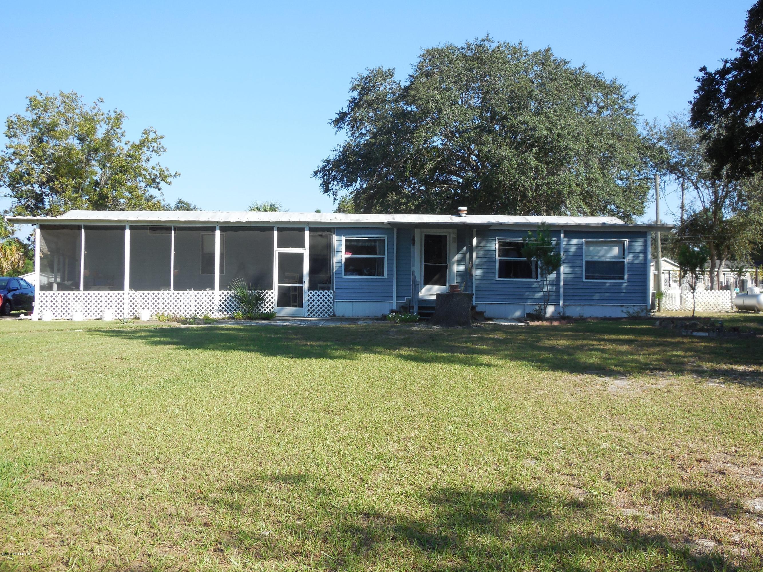 105 Ketner Road Welaka, FL 32112 - Photo 5 of 34 a view of a house with swimming pool and porch