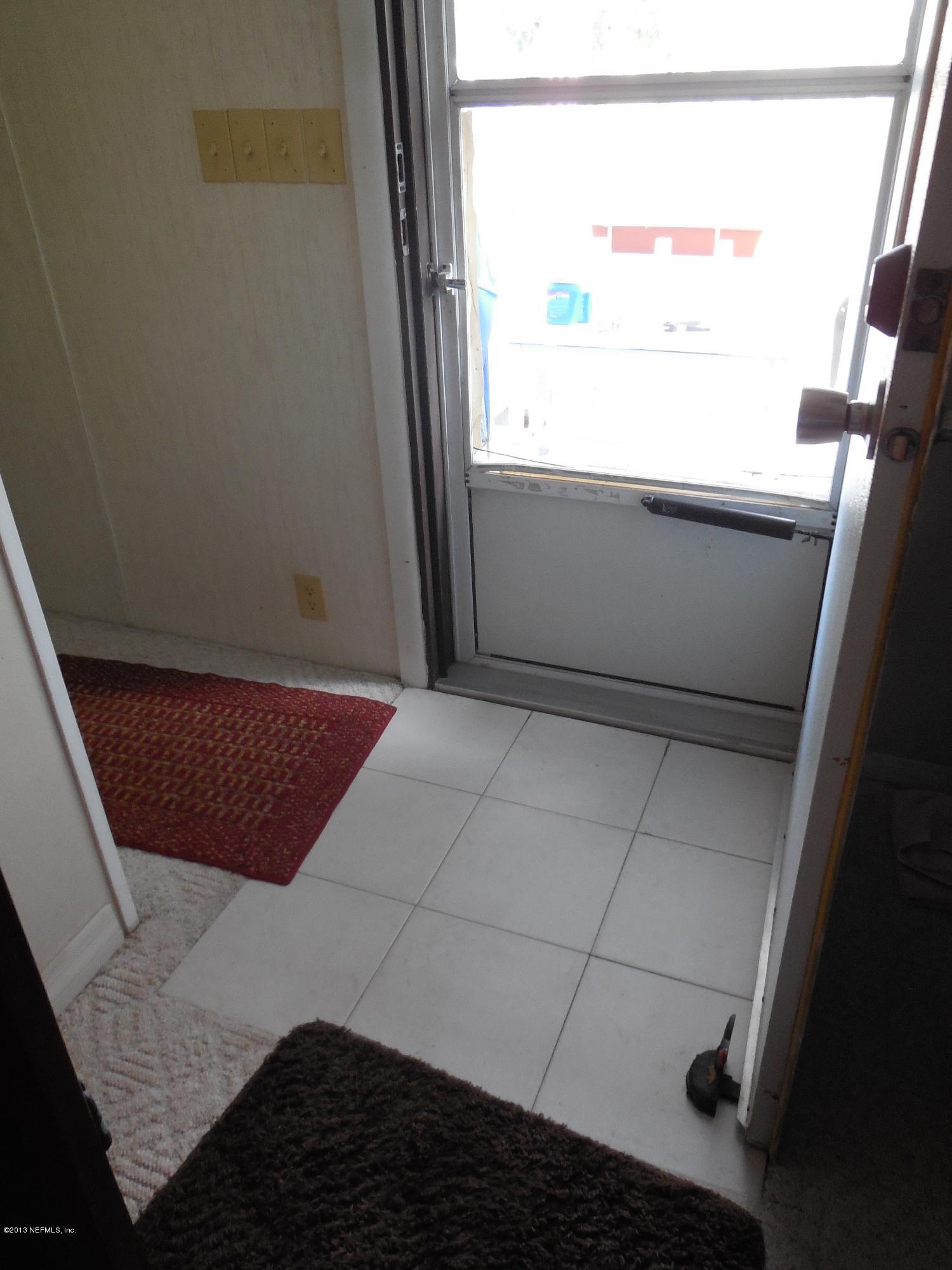 105 Ketner Road Welaka, FL 32112 - Photo 6 of 34 a view of an empty room and window