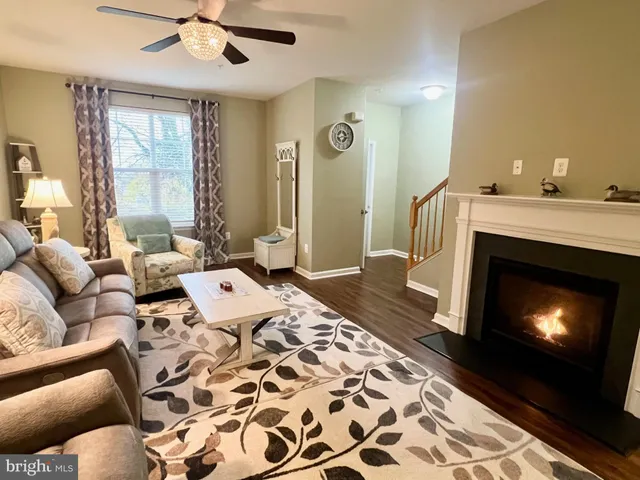 a living room with a couch and a fireplace