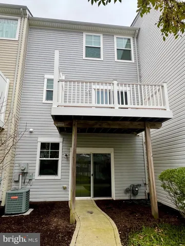 a view of a backyard with large trees
