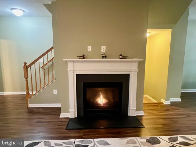 a picture of a bench in front of a wall