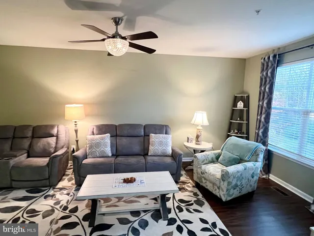 a living room with a couch and a window