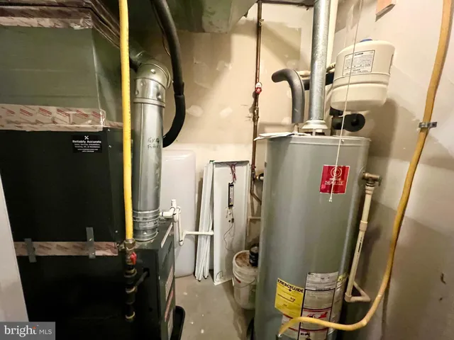a bathroom with a double vanity sink toilet and mirror
