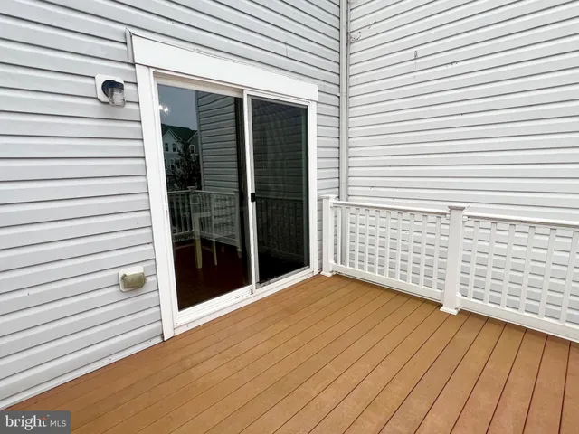 a view of a porch with wooden floor