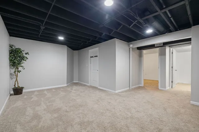 a bedroom with a bed and a television