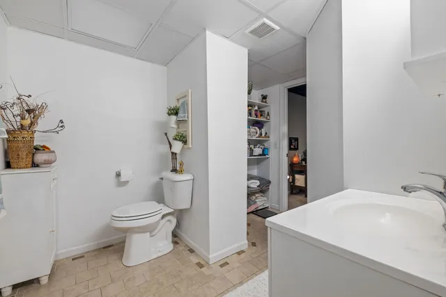 a bathroom with a shower and a sink