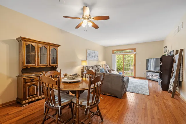 a view of a livingroom with furniture window and wooden floor