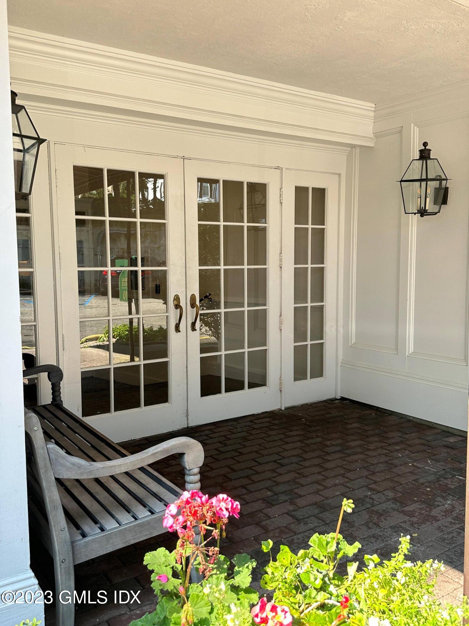 20 Brookside Drive, Unit 3D Greenwich, CT 06830 - Photo 2 of 24 a front view of a house with a yard