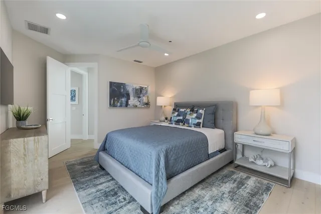 a bedroom with a bed and a couch