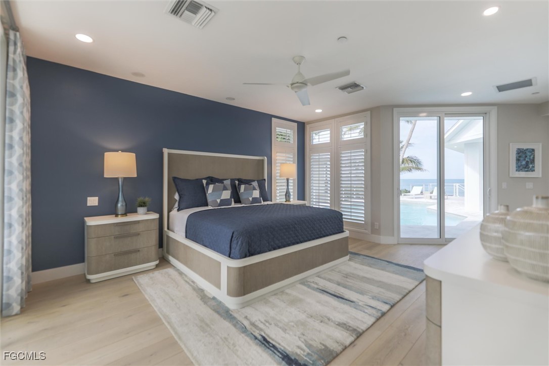 941 South Seas Plantation Road Captiva, FL 33924 - Photo 17 of 50 a bedroom with a large bed and a large window