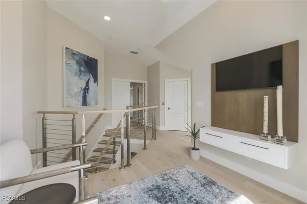 a view of an entryway with wooden floor