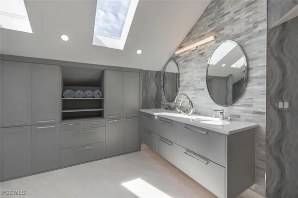 a bathroom with a sink and mirror