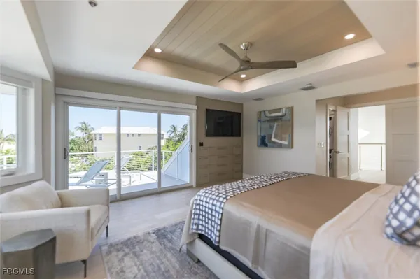 a bedroom with a large bed and a large window