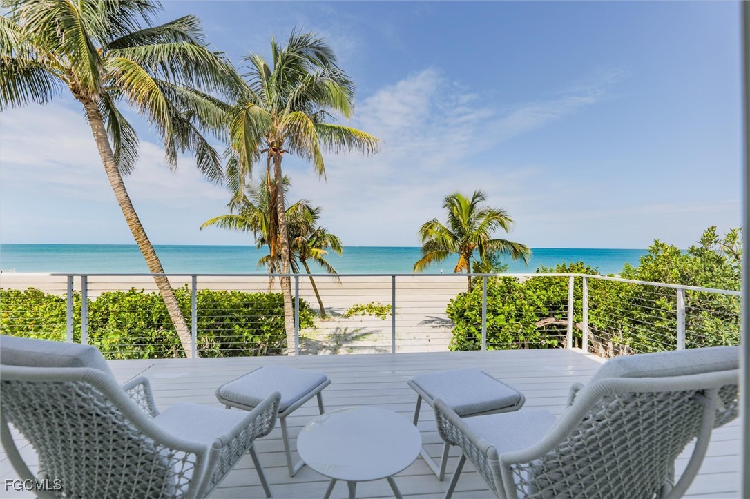 941 South Seas Plantation Road Captiva, FL 33924 - Photo 37 of 50 a view of a chair and table in patio with wooden fence