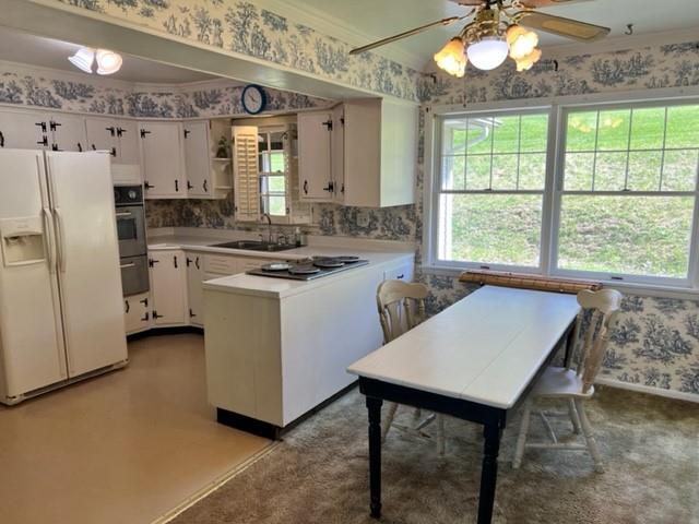 5 Matthews Spur Road Eighty Four, PA 15330 - Photo 4 of 25 a kitchen with a stove a refrigerator and a table
