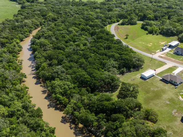 a view of a field with an ocean