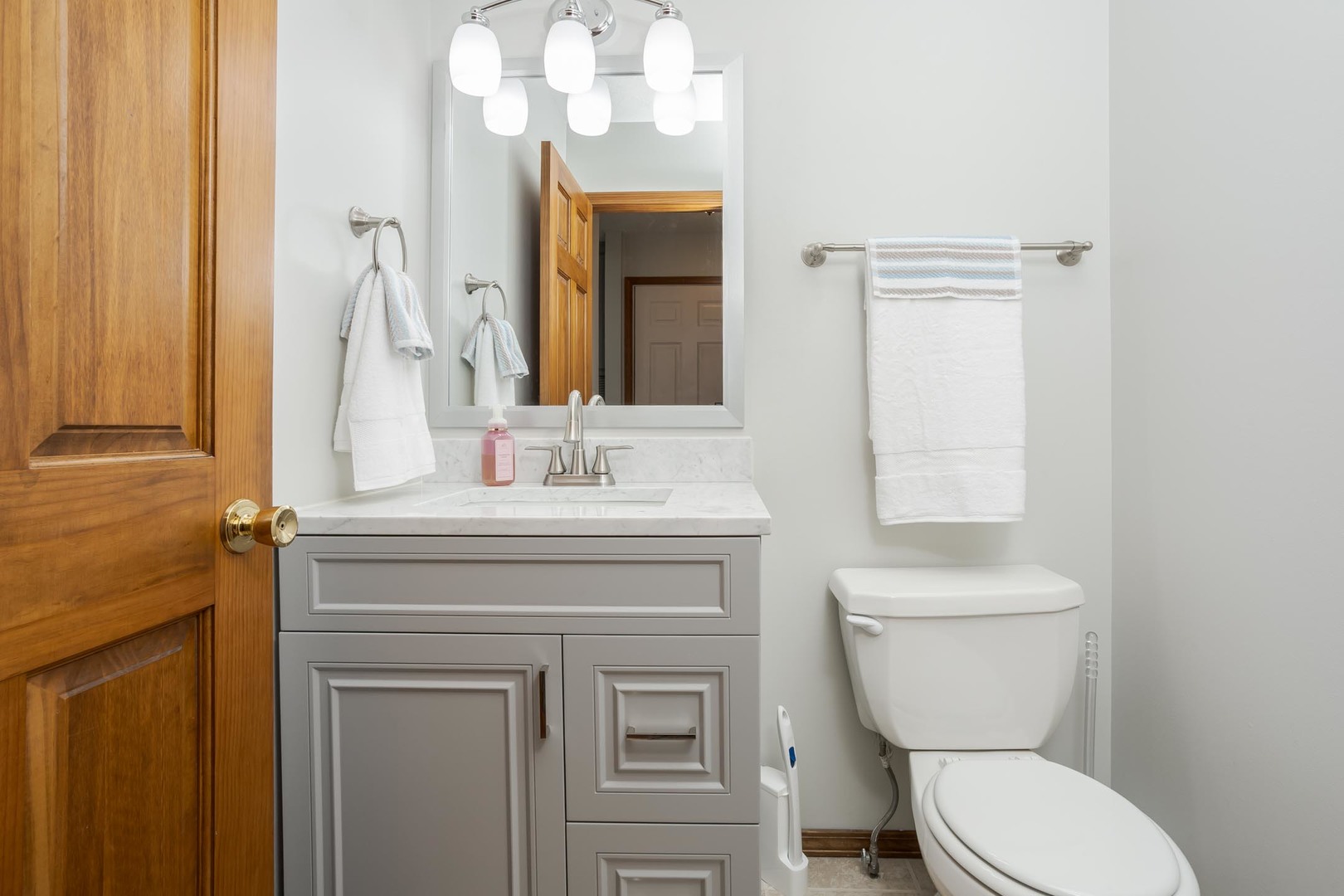 814 Landau Lane Normal, IL 61761 - Photo 32 of 58 a bathroom with a toilet a sink and mirror