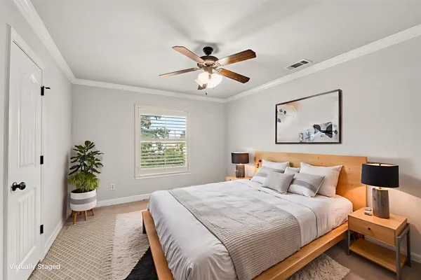 a bedroom with furniture and a chandelier