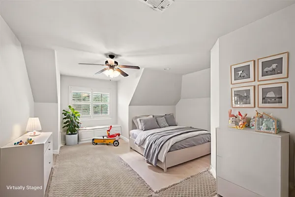 a living room with furniture and a book shelf