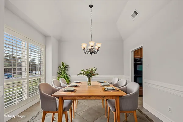 a kitchen with granite countertop a sink stainless steel appliances and cabinets
